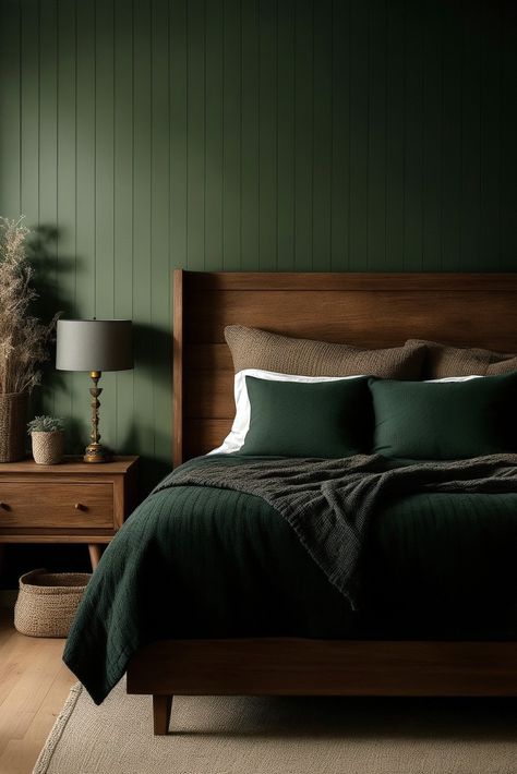 Transform your bedroom into a cozy space with dark cottagecore vibes: a room that has warmth and charm. It all starts with a spacious queen-size bed, featuring a wood frame and a headboard with simple spun legs. Layers of soft pillows and deep green bed covers invite you to snuggle in. Beside the bed, sits a mid-century nightstand with an intricate table lamp. But what truly sets the mood is the back wall in dark sage wood panels. Green Bedroom Decor, Sage Green Bedroom, Wooden Bed Frame, Moody Bedroom, Green Walls, Green Rooms, Bedroom Green, Master Bedrooms Decor, Remodel Bedroom