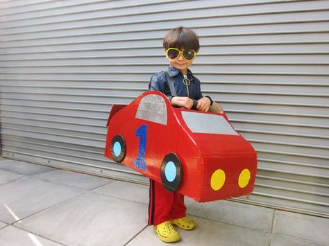 A fast and fun cardboard car costume easy to make with a couple cardboard boxes, red paint, and a hot glue gun. Cardboard Car Costume, Cardboard Bus, Race Car Costume, Cars Halloween Costume, Diy Toys Car, Car Costume, Cardboard Box Car, Large Cardboard Boxes, Cardboard Car