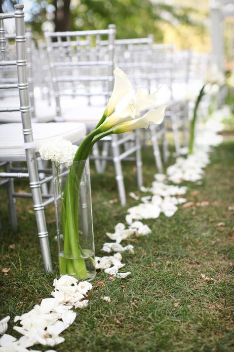 Aisle decor, outdoor wedding ceremony, white rose petals, white calla lilies Calla Lily Wedding Ceremony, Calla Lily Wedding Decorations, Aisle Decor Outdoor, Wedding Courtyard, Calla Lillies Wedding, Wedding Flowers Ceremony, Wedding Aisle Decorations Outdoor, White Rose Petals, Eucalyptus Wedding Decor