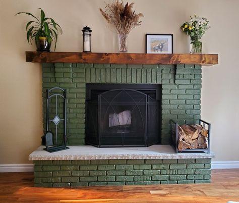 Colored Fireplace Painted Brick, Dark Green Painted Fireplace, Unique Brick Fireplace, Dark Green Fireplace Tile, Painted Green Brick Fireplace, Unusual Fireplace Ideas, Painted Fireplace Green, Split Level Fireplace, Green Stone Fireplace