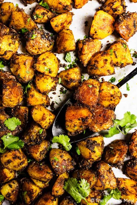 Aromatic and comforting, these Bombay potatoes are bursting with flavor! Parboil potatoes, generously coat them in an easy to make curry oil, then roast them to fragrant, crispy perfection. The potatoes are a hearty and satisfying base to rich and aromatic spices, blending flavor and comfort food into an incredible Indian-inspired side dish. #theendlessmeal #potatoes #bombaypotatoes #roastpotatoes #roastedpotatoes #dinner #sidedish #curry Bombay Potato Recipe, Indian Potato Recipes, Self Note, Curry Side Dishes, Bombay Potatoes, Indian Soup, Spring Mix Salad, Indian Side Dishes, Masala Sauce