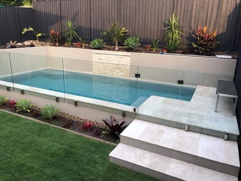 Pool Into Hillside, Small Raised Pools Backyard, Step Up To Pool Area, Elevated Pool Landscaping, Pools On Sloped Yard, Semi Above Ground Pool Deck Ideas, Raised Pool Landscaping, Fiber Glass Pool Ideas, Small Garden With Pool