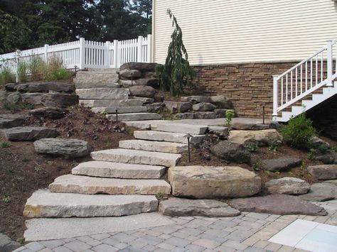 Overlapping and offset block stone steps.  I like the low rise and longer tread on these steps. Terraced Patio Ideas, Landscape Steps, Landscaping On A Hill, Landscaping With Boulders, Stone Steps, Stone Stairs, Tiered Garden, Hillside Landscaping, Outdoor Stairs