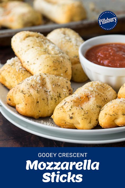 Ooey gooey cheese in a parmesan crusted flaky crescent roll... How delicious does that sound? These Crescent Mozzarella Sticks are perfect as an after school snack, game day, or just when you're in the mood for cheese! 🧀 #Pillsbury #PillsburyCrescents #MozzaSticks #Appetizer Recipes With Mozzarella Sticks, Cheese Stick Crescent Rolls, Mozzarella Sticks Crescent Rolls, Crescent Cheese Sticks, Crescent Roll Mozzarella Sticks, Crescent Roll Cheese Sticks, Mozarella Sticks Recipes, Mozzarella Crescent Rolls, Pilsbury Crescent Rolls