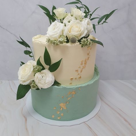 Cream and Sage Green Wedding Cake with Buttercream finish, two tier, gold leaf, fresh flowers wedding cake Two Tier Wedding Cake Sage Green, Two Tier Sage Green Cake, Save Green Wedding Cake, Sage Green Birthday Cake 2 Tier, Two Tier Green Cake, Sage Green Cake Wedding, Sage Green And Gold Birthday Cake, Sage Green Wedding Cake Ideas, Sage Green And Gold Cake