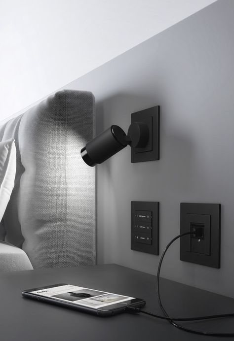 Lighten up: Plug & Light | News Black Light Switch, Bed Reading Light, Bedroom Reading Lights, Modern Light Switches, Headboard Lamp, Light Switches And Sockets, Hotel Room Design, Smart Home Design, Modern Lighting Design