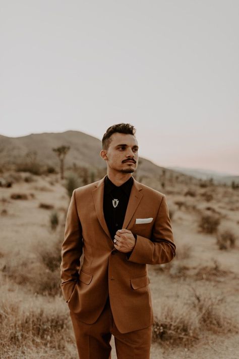 This Desert Elopement in Joshua Tree, gave me all the desert boho dreams! The brides, Dreamers and Lovers lace wedding dress went perfectly with the dried floras, desert backdrop and the grooms burnt orange wedding suit. Desert Elopement / National Park Elopement / Bolo tie for groom / Sunset Bridal Portraits / Boho Wedding Ideas. Browse the blog to see more of this stunning Desert Elopement. Click to Inquire with me on my website, for your Southern California wedding or elopement! Alyssa Mariee Burnt Orange Tuxedo Wedding, Burnt Orange Tuxedo, Burnt Orange Suit, Fall Groomsmen, Dnd Outfits, Suit For Groom, Desert Backdrop, Homecoming 2022, Grooms Attire