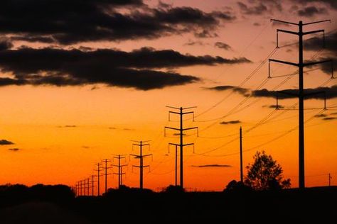 Energy in the sunset - Power lines leading from the Prairie State Energy Plant outside of Marissa, Il (Photo by Gila Todd) Power Lines, The Sunset, Stars And Moon, The Outsiders, Moon, Energy, Sun, Stars, Plants