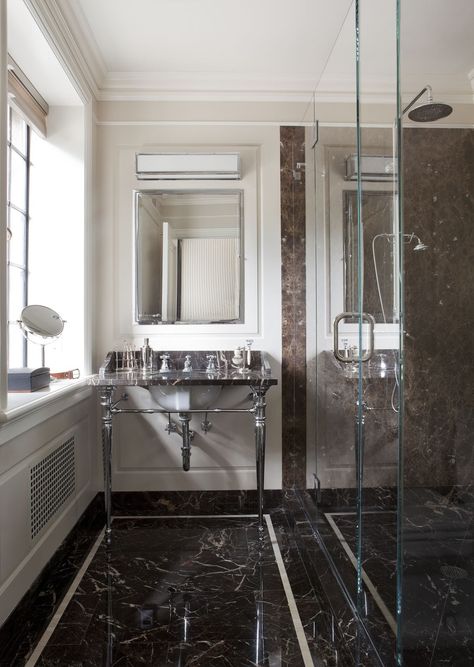 The husband’s sleek bath features a wall light by Circa Lighting, an Urban Archaeology vanity, and a mirror and shower fittings by Lefroy Brooks. Lefroy Brooks, Masculine Bathroom, Guest Bathroom Decor, Narrow Bathroom, Stone Bathroom, Shower Fittings, Circa Lighting, Historic Home, Architectural Digest