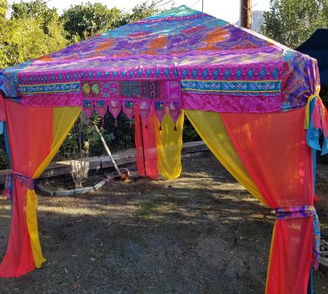 "Vendor Canopy Tent Cover Only Made To Order (pictured) 1-2 weeks Fits a 10 x 10 Canopy. The canopy I use is called Everbilt..they are sold at Home Depot The top is approx 148\" x  148\" Created with a bright colored bohemian design light polyester fabric..   Flag valance with red tassels and sequined embroidered fabric from India in the front.. The curtains are a bright colored chiffon The corners are tied with elastic and can be easily pushed inside through spaces at the corners if preferred T Festival Tent, Face Paint Set, Craft Booths, Boho Tent, Exhibit Ideas, Twig Furniture, Tent Canopy, Diy Canopy, Fabric Flag