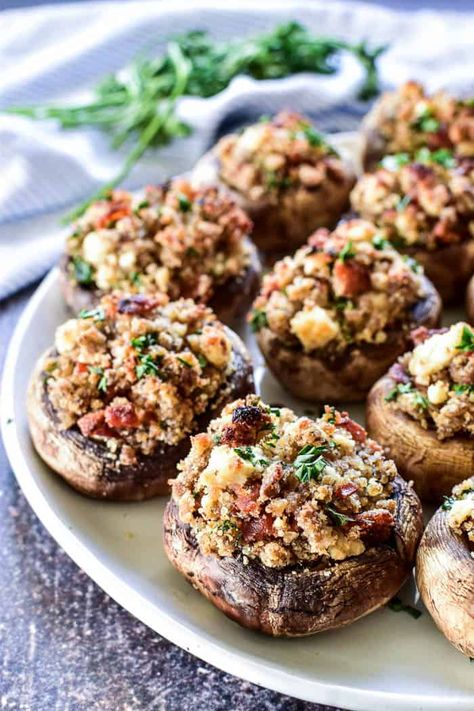 Stuffed Mushrooms are the ultimate party appetizer, and this recipe is the BEST. Loaded with crispy bacon, creamy goat cheese, and perfectly buttered breadcrumbs, they're a flavor explosion in every bite. They make the perfect addition to holiday menus, cocktail parties, or New Year's Eve... and everyone who tries them LOVES them. Believe me when I say you really can't eat just one!! Best of all, they're super simple to make and turn out delicious every time. If you're looking for a go-to appeti Cheesecake Factory Stuffed Mushrooms, Best Stuffed Mushrooms, Baked Stuffed Mushrooms, Easy Stuffed Mushroom Recipe, Stuffed Mushroom Recipe, Lemon Tree Dwelling, Stuffed Mushrooms Easy, Dinner Then Dessert, Mushroom Recipe