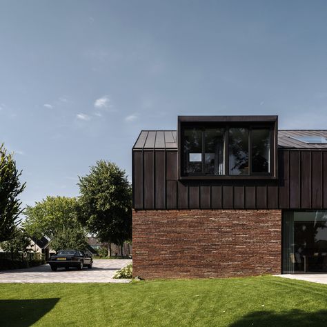 Villa IJsselzig by EVA Architecten is a riverside home featuring red-brick walls and a patinated copper roof Modern Mansard, Loft Exterior, Zinc Cladding, Zinc Roof, Red Brick Walls, Riverside House, Mansard Roof, Roof Extension, Metal Cladding