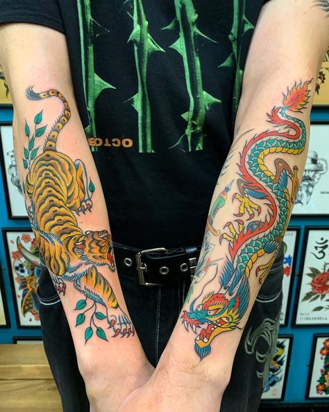 ⚡️ Double trouble ⚡️ Both Tiger and Dragon forearm tattoos in one day Bernard Kwok in the studio every Thursday to Saturday, knocking it out the park with these 2 immense pieces ! Call to book in or drop by to check out available designs for inspo Color Forearm Tattoo, Old School Dragon Tattoo, Traditional Japanese Tiger Tattoo, Forearm Dragon Tattoo, Tiger Tattoo Forearm, Traditional Dragon Tattoo, Dragon Tattoo Forearm, Dragon Tiger Tattoo, Dragon Hand Tattoo