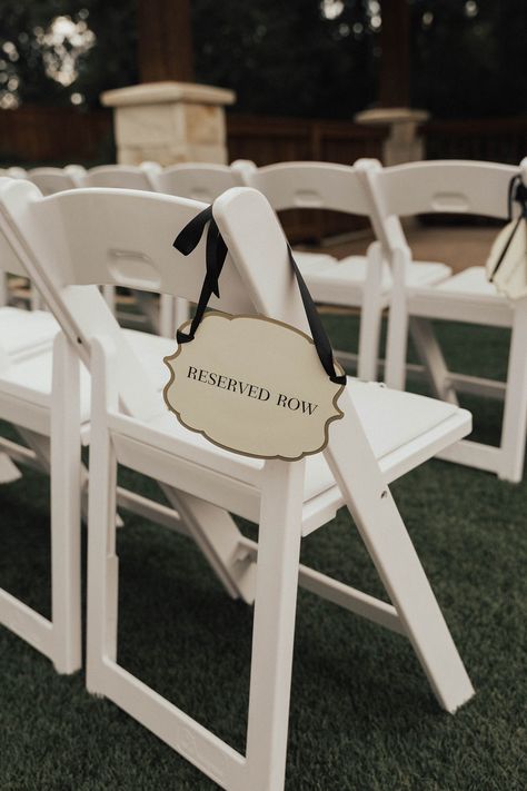 | classy reserved row wedding ceremony signs | outdoor wedding ceremony sign ideas | wedding ceremony ideas | ways to reserve the front rows of your wedding ceremony | wedding ideas | wedding tips | outdoor wedding ceremony | photo taken at THE SPRINGS Event Venue. follow this pin to our website for more information, or to book your free tour! SPRINGS location: Norman, OK photographer:  Hannah Nichols Photography #weddingceremony #outdoorwedding #weddingday #weddingideas #weddinginspiration #okc Reserved Rows At Wedding, Bench Decor Wedding Ceremony Seating, Row Reserved Sign Wedding, Outdoor Wedding Ceremony White Chairs, Ceremony Details Wedding, Ceremony This Way Sign, Reserved Row Wedding Sign, Wedding Ceremony Welcome Table, Wedding Ceremony Set Up Outdoor