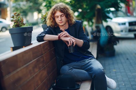 Checking Watch Pose, Man Sitting On Bench, Bench Photography, References Poses, Hair With Hat, Man With Curly Hair, Sitting On Bench, Reddish Hair, Newspaper Photo