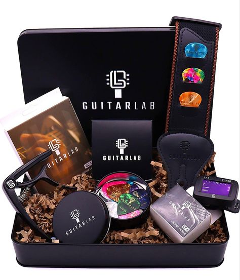 Guitar accessories gift box for acoustic and electric Guitar Tuners, Guitar Gifts, Acoustic Guitar Strings, Guitar Lovers, Accessories Packing, Tin Gifts, Guitar Accessories, Ukelele, Guitar Picks