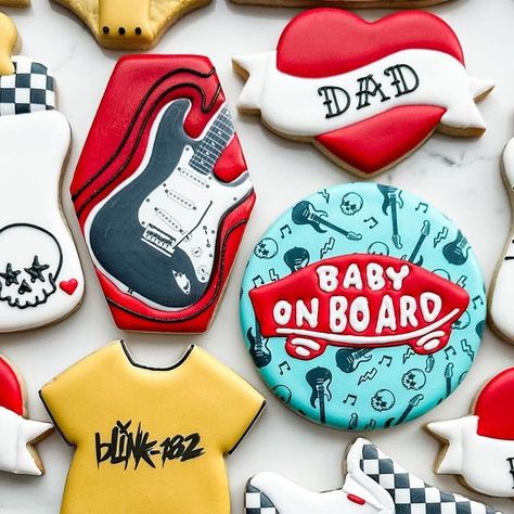 Mandy Edmunds on Instagram: "Have you ever seen baby shower cookies that rocked so hard? 👶🏻🤘🏻 These new parents requested a “Vans Warped Tour” theme, complete with band t-shirt onesies, classic checkered Vans, and electric guitars. So fun!  #sugaredupcookies  #customcookies #babyshowercookies #punkrockcookies #punkrock #rocknrollbaby #babyonboard #vanswarpedtour #warpedtour #warpedtourcookies #vanscookies #thevandals #blink182 #rancid #nofx #guitarcookies #vansshoes #hearttattoo #tattoocookies" Punk Rock Baby Shower Ideas, Rockstar Baby Shower Ideas, Edgy Baby Shower Theme, Warped Tour Baby Shower Theme, Skateboard Baby Shower Ideas, Born To Rock Baby Shower Ideas, Vans Warped Tour Birthday Party, Emo Baby Shower Ideas, Vans Baby Shower Theme