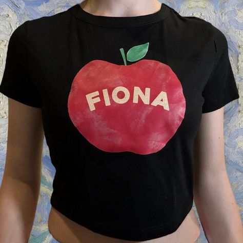 fiona apple inspired baby tee! fiona apple shirt, poster, sticker, fiona apple tank top, tshirt, necklace, fiona apple merch, accessories by cocoschains on Etsy Fiona Apple Shirt, Merchandise Packaging, Apple Clothes, Sabrina Carpenter Merch, Apple Shirt, Carpenters Shirts, Tshirt Necklace, Packaging Orders, Fruit Shirt