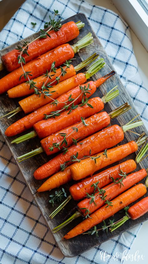 Overhead view of honey roasted carrots with fresh thyme on wooden board, receiving natural light, elegant text overlay Bisquick Banana Muffins, Roasting Carrots, Candied Pecans Recipe, Candied Carrots, Roasted Carrots Recipe, Honey Roasted Carrots, Carrots Recipe, Banana Muffin Recipe, Muffin Recipes Blueberry