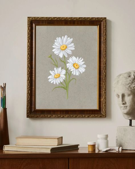 Painting of daisies on a gray background framed in a vintage frame. Surrounding it are books and other decorative items. April Birth Flower, Flower Art Print, Acrylic Gouache, Birth Month Flower, Toned Paper, Flower Prints Art, Birth Month Flowers, Birth Flower, Birth Month