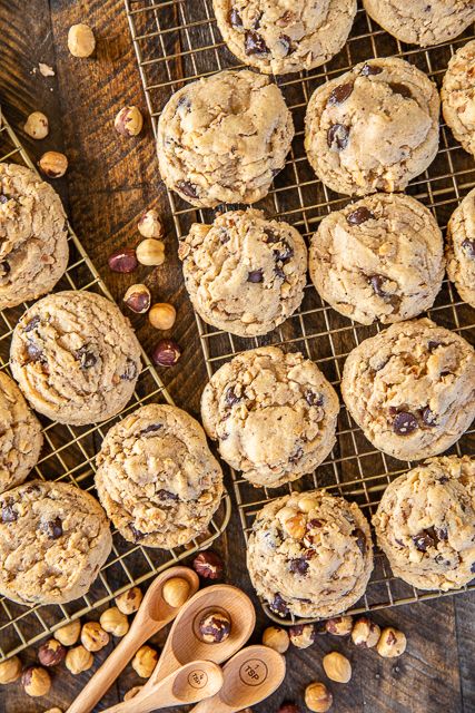 Dark Chocolate Chip Hazelnut Cookies - dangerously delicious! Crunchy on the outside and chewy on the inside - perfect!!! Can make dough ahead of time and freeze for a quick sweet treat later. Bisquick, brown sugar, white sugar, butter, egg, vanilla, dark chocolate chips, hazelnuts. These things FLY off the plate. All you need is a glass of milk and you are set! SO good! #cookies #bisquick #hazelnuts Cookies Dark Chocolate, Hazel Nut, Mini Chocolate Chip Muffins, Triple Chocolate Chip Cookies, Dark Chocolate Chip Cookies, Salted Chocolate Chip Cookies, Hazelnut Cookies, Dark Chocolate Cookies, Double Chocolate Chip Cookies