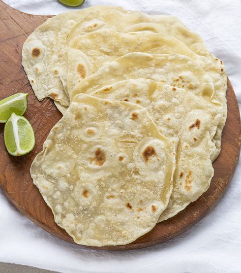 Overhead View of Homemade Tortillas on Wooden Platter Fluffy Tortillas, Tortillas Recipes, Fajita Night, Flour Tortilla Recipe, Taco Shell Recipe, Homemade Tortilla Recipe, Soft Taco Shells, Homemade Flour, Recipes With Flour Tortillas