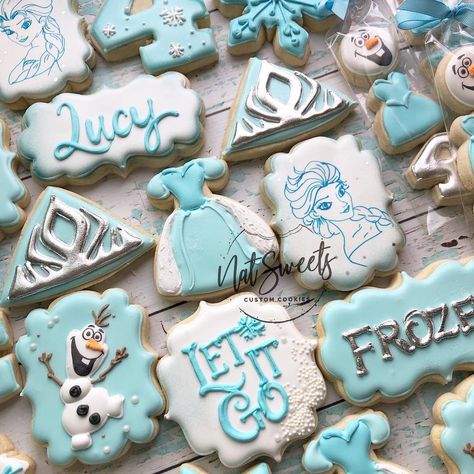 Image may contain: 2 people, food Frozen Birthday Party Decorations, Elsa Birthday Party, Frozen Decorations, Frozen Party Decorations, Disney Frozen Birthday Party, Princess Cookies, Frozen Birthday Theme, Disney Cookies, Disney Frozen Birthday