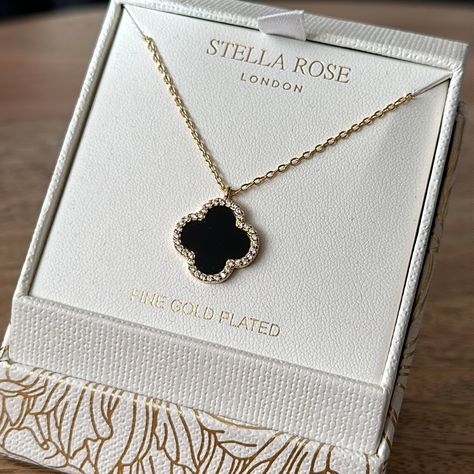 Gold Plated Clover Necklace | Onyx Discover Elegance With This Stunning Gold-Plated Necklace Featuring A Chic Black Clover Charm Adorned With A Sparkling Cubic Zirconia Border. This Necklace Adds A Touch Of Sophistication To Any Outfit. Perfect For Both Everyday Wear And Special Occasions. Elevate Your Jewelry Collection With This Timeless Piece! New. By Stella Rose Black Clover Necklace, Black And Gold Necklace, Onyx Color, Stella Rose, Cowrie Shell Necklace, Padlock Necklace, Onyx Colour, Silver Bar Necklace, Kendra Scott Necklace