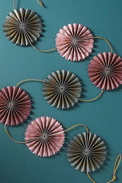 AnthroPerks Preview: The Holiday Shop | Anthropologie Paper Fan Garland, Fan Garland, Silver Tinsel Tree, Anthropologie Decor, Anthropologie Christmas, Cedar Wreath, Paper Fan, Globe Ornament, Party Garland