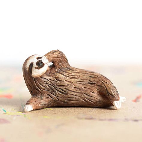 If you want a spirit animal that is as laid back and easy going as yourself, you need to carry the Le Pondering Sloth Totem with you. As opposed to a majestic eagle or a savage panther, this 1.75” polymer clay animal totem features the [...] Polymer Clay Animals, Clay Animals, Ceramic Animals, Clay Figures, Animal Totems, Sculpture Clay, Clay Sculpture, Clay Charms, Polymer Clay Art