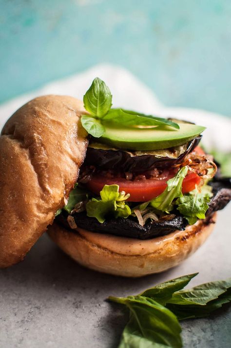 Devour these delicious veggie burgers with grilled portobello mushrooms and eggplant! Fried shallots, more fresh veggies, and a smoky mayo make this a healthier way to get your burger fix. Eggplant Fried, Grilled Portobello Mushroom Burger, Portobello Mushroom Burger, Portobello Mushroom Recipes, Grilled Portobello, Vegetarian Barbecue, Mushroom Burger, Fried Shallots, Grilled Eggplant