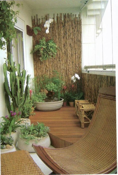 Transform your balcony into a mini garden. You can do this with help from an array of potted plants, wooden chairs and bamboo walls. Pick out various tropical plants, flowers and cacti to complete the look. Balcon Mic, Apartment Balcony Garden, Balkon Decor, Balcony Plants, Vertical Gardens, Outdoor Room, Balcony Furniture, Apartment Balcony Decorating, Balcony Design