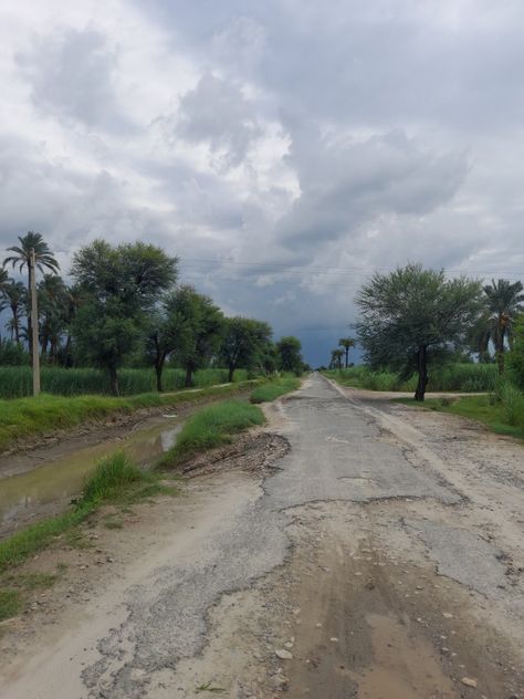 Broken road alongside lake in village. This visual is after heavy rain on the path. Rain In Village, Village Life Photography, Rain Village, Random Clicks, Photoshop Backgrounds Backdrops, Photoshop Backgrounds, Village Life, Life Photography, Country Roads