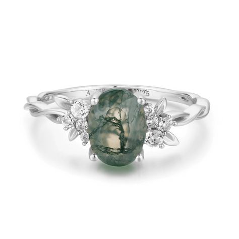 Magical, otherworldly, enchanting. Our Enchanted Garden Moss Agate Ring has earned its name with a stunning oval-cut moss agate center stone adorned with clusters of round white topaz gems in a twisted band. May this piece allow you to spread the seeds of happiness and cultivate a life you love.  *Please be informed that your moss agate patterns are naturally distinct and unique from the portrayed picture, and you will never witness the same pattern in two gems. It is one of a kind with a unique Twisted Band Ring, Agate Engagement Ring, Moss Agate Ring, Gold Vermeil Jewelry, Green Rings, Twisted Band, Ring White Gold, Enchanted Garden, Vermeil Jewelry