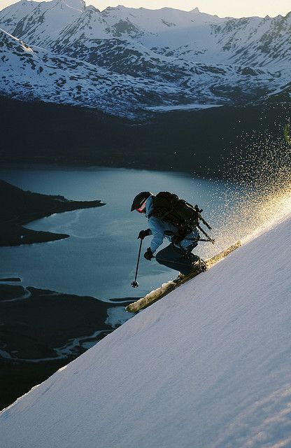 Skiing above Sorfjorden in Lyngen Alps, Norway. Norwegians are the worlds first skiers. In the 1940s there was one place to ski. In Idaho "Sun Valley". I believe it was built for a Sonja Henie Movie in the 1930s, early 40s. Few people tried the slopes. It caught on through movies etc. Sonja Henie - famous Norsk movie star. Winter sports, Skating primarily. Looks Adidas, Ski Bums, Go Skiing, Ski Outfit, Vail Colorado, Ski Resorts, Ski Season, Winter Sport, Snow Skiing