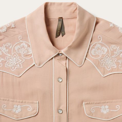 This blush rayon western shirt is crafted from soft, smooth 100% rayon crepe and features statement-making, retro-style cream piping and embroidery. It has single point front and back yokes, front faux pocket flaps, five-snap cuffs and a full snap front. Cut with an easy drape, in our flattering boyfriend fit which allows for comfort and freedom of movement. 1 Point Curved Front And Back Yokes Front Faux Pocket Flaps Cream Piping And Embroidery 5 Snap Cuff Boyfriend Fit 100% Rayon Imported Western Shirt Embroidery, Western Shirt Women, Womens Western Tops, Pink Shirt Outfit, Embroidered Western Shirt, Vintage Western Shirt, Country Fits, Western Americana, Busch Light