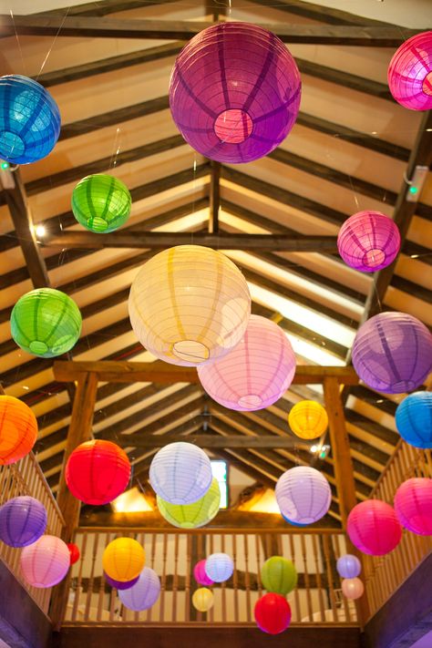 Bright coloured paper lanterns really enlighten this dark beamed venue, this bride picked all the colours of the rainbow! Very funky! Hanging Paper Lanterns Classroom, Colourful Decorations, Pride Decorations, Colour Festival, Marquee Decoration, Carnival Baby Showers, Cocktail Party Decor, Carnival Decorations, Hanging Paper Lanterns