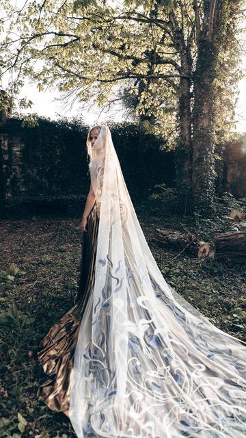 Rue De Seine Wedding Dresses on Instagram: "INTRODUCING: The To The Moon Veil 🌙💙 Discover the magic of the midnight moon with this enchanting new veil design. This exciting new veil draws inspiration from a nostalgic, bohemian Paris. Adorned with Art Nouveau vines and a central moon, it’s perfect for the bride who writes her own story.

Does this bridal look speak to you? Let us know in the comments x

#ToTheMoonVeil #RueDeSeine #RueDeSeinebridal #bridal #bridetobe #weddingdress #weddingday #bride #engaged #veil #uniqueveil #veilinspo #weddingaccessories #weddingdressinspo #love #weddinginspiration #dreamveil #dreamdress #yestothedress #dreamwedding #bridaldesigner #editorialwedding #weddingphotographer #bridalshop #weddingreels #bridalreels #weddingideas #bridalstyle #2025bride #2025wed Moon Veil, Celestial Veil, Unique Veil, Rue De Seine Wedding Dress, Starlit Night, Rue De Seine Bridal, Midnight Moon, Wedding Gown Brand, Gold Wedding Dress