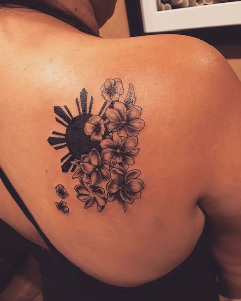 Flowers and sun tattoo on the back shoulder | www.otziapp.com Filipino Shoulder Tattoos For Women, Small Filipino Tattoos For Women, Nicaragua Flower Tattoo, Filipino Flag Tattoo Design, Three Stars And A Sun Tattoo Philippines, Phillipino Tattoo Design, Filipino Star Tattoo Women, Tattoo Ideas Filipino, Philippine Tattoo Ideas