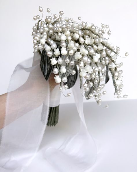 📸 Second & last show mid progress. 🤍 Custom Livet bouquet for a bride in the UAE getting married this week. She opted for the lily of the valley teardrop wedding bouquet with some all freshwater pearl stems mixed in. Elegant and timeless. Always an honor to have the heirloom floral from the studio chosen to celebrate love. #uaewedding #elegantwedding #floralart #luxurywedding Pearl Bouquet Wedding, Bouquet Styles, Bridal Bouquet Styles, Pearl Bouquet, Creative Wedding Gifts, Celebrate Love, Creative Wedding, Lily Of The Valley, Wedding Bouquet