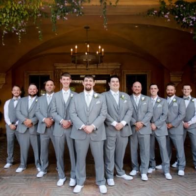 Groomsmen and groom posing in their grey suits and all white shoes | One Fine Day Photography | villasiena.cc Light Grey Groomsmen, Groomsmen In Different Shades Of Grey, Men’s Light Grey Suit Wedding, Groomsmen Attire Light Grey, Groomsman Grey Vest, Grey Tux, All White Shoes, White Dress Shoes, One Fine Day