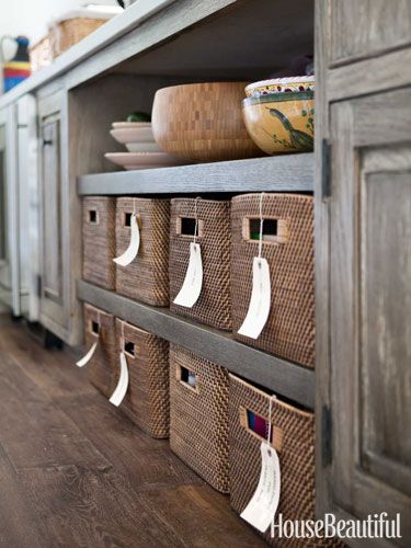 Labeled baskets help organize the pantry in a Los Angeles kitchen. Design: Chris Barrett. LOVE baskets in a pantry - need to have mine look like this though. Labeling Ideas, Beautiful Baskets, Clever Kitchen Storage, Quirky Kitchen, Kitchen Basket Storage, Small Kitchen Storage, Furniture Handmade, Woven Baskets Storage, Small Kitchens