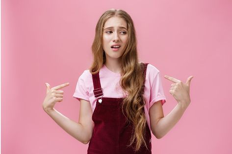 Self-assured arrogant young female student with high ego standing cocky and brag about herself pointing at her with cool snobbish look looking away to right with contempt posing over pink wall. Body language and emotions concept Snobby People, Arrogant People, Ryan Giggs, Sense Of Entitlement, Bigger Person, Life Satisfaction, Genuine Smile, Intelligent Women, Greater Good