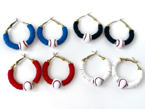 Support your team or your player in these stylish baseball hoop earrings! Baseball earrings are lightweight and the perfect size for all-day wear at the ball field.  All baseball hoops are 35mm (1 inch hoops) with heishi beads in the color of your choice and 1 acrylic baseball bead in the center. Earrings come with a lever-back closure on an 18k gold plated hoop earring. All hoops are nickel free and hypoallergenic. Materials:  - 18k gold plated hoop earrings (1 inch) - Clay heishi beads - Acrylic baseball bead Color: Please select your color choice from the drop down menu. Don't see your team's color? Message me to check availability. Bulk/Team Orders: For group or team discounts (Ex. one person ordering multiple pairs for an all-star team), please message me before purchase, and I can cr Diy Baseball Jewelry, How To Make Clay Bead Earrings, Brave Jewelry, Earrings Cricut, Heishi Jewelry, Jewelry School, Sports Earrings, Baseball Jewelry, Mom Gifts Jewelry