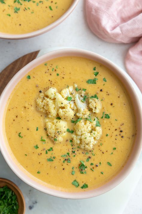 This Roasted Cauliflower Soup has lots of hidden veggies in it and is absolutely delicious while also being so filling! It's the ultimate cold weather soup that everyone will love! Cauliflower Soup Healthy Clean Eating, Cauliflower Garlic Soup Recipes, Roasted Cauliflower Soup Damn Delicious, Golden Cauliflower Soup, Healing Cauliflower Soup, Vegetarian French Onion Soup, Cauliflower Vegetable, Cauliflower Potato Soup, Cold Weather Soup