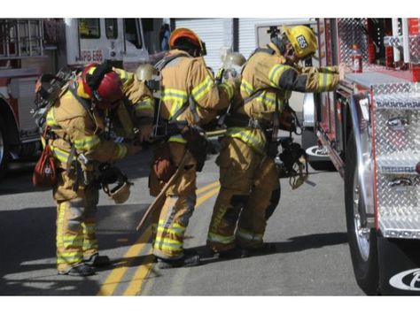 Firefighters with the Newport Beach Fire Department change air bottles while battling a fire at a house on Heather Lane in Newport Beach. Beach Fire, Volunteer Firefighter, Us Soldiers, Public Safety, First Responders, House Fire, Fire Rescue, National Guard, Chevy Camaro