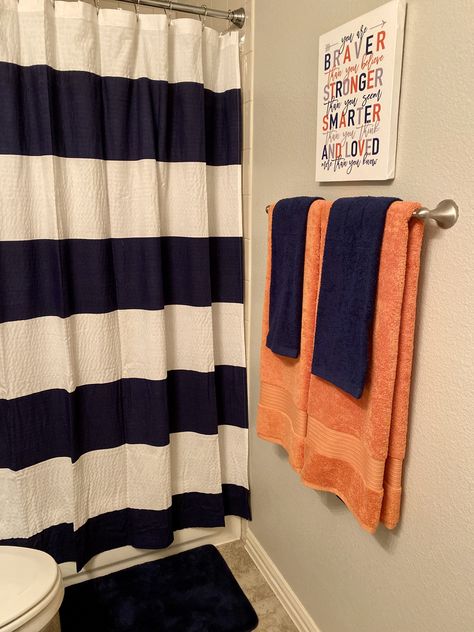 Navy and orange bathroom Orange bathroom decor Boys bathroom Navy And Orange Bathroom, Orange Black Bathroom, Blue And Orange Bathroom, Boys Bathroom Ideas Kid, Men Bathroom Ideas, Teenage Bathroom, Navy Blue Bathroom Decor, Fun Kids Bathroom Ideas, Teen Boy Bathroom