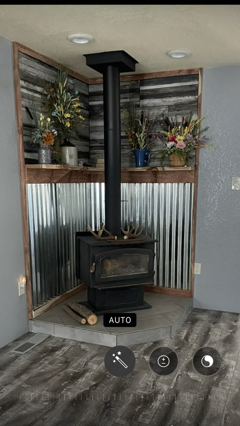 Rustic Gas Fireplace, Stove Decor Ideas, Kitchen Stove Decor, Corigated Metal, Wood Burning Stove Corner, Corner Wood Stove, Wood Stove Surround, Wood Stove Ideas, Stove Decor