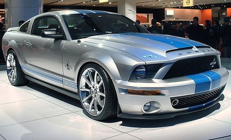 Shelby GT500KR at NYIAS. Ford Shelby GT500KR, revealed at the 2007New York International Auto Show, was released in the spring of 2008. The car is powered by a 540 horsepower 5.4-liter (330 CID) supercharged V-8 version of the base GT500 engine with functional Cold Air Intake and unique calibration. Midnight Drive, Mustang Shelby Cobra, Ford Shelby Cobra, Shelby Mustang Gt500, Black Cadillac, Ford Mustang 2015, Blue Mustang, Ford Mustang Shelby Gt, Mustang Car