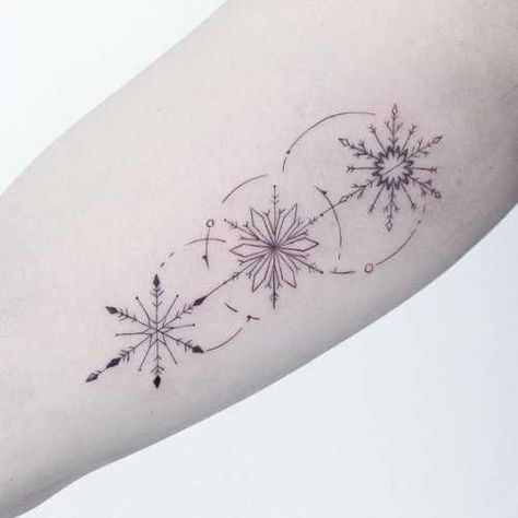 25 Snowflake Tattoo Ideas: Channeling the Beauty of Winter's Delicacy Snowflake Tattoo Women, Snowflake Tattoo Back Of Neck, 3 Snowflake Tattoo, Snowflake Arrow Tattoo, Tattoo Ideas Snowflake, Snow Flake Tattoos For Women, Sun And Snow Tattoo, Ornamental Snowflake Tattoo, Winter Tattoo Ideas Snow